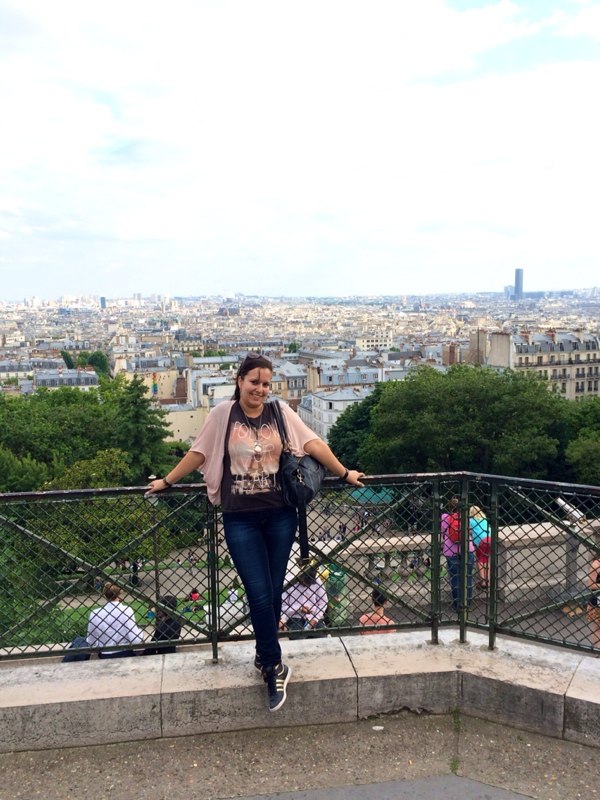 me at sacre coeur with a view over the streets of paris