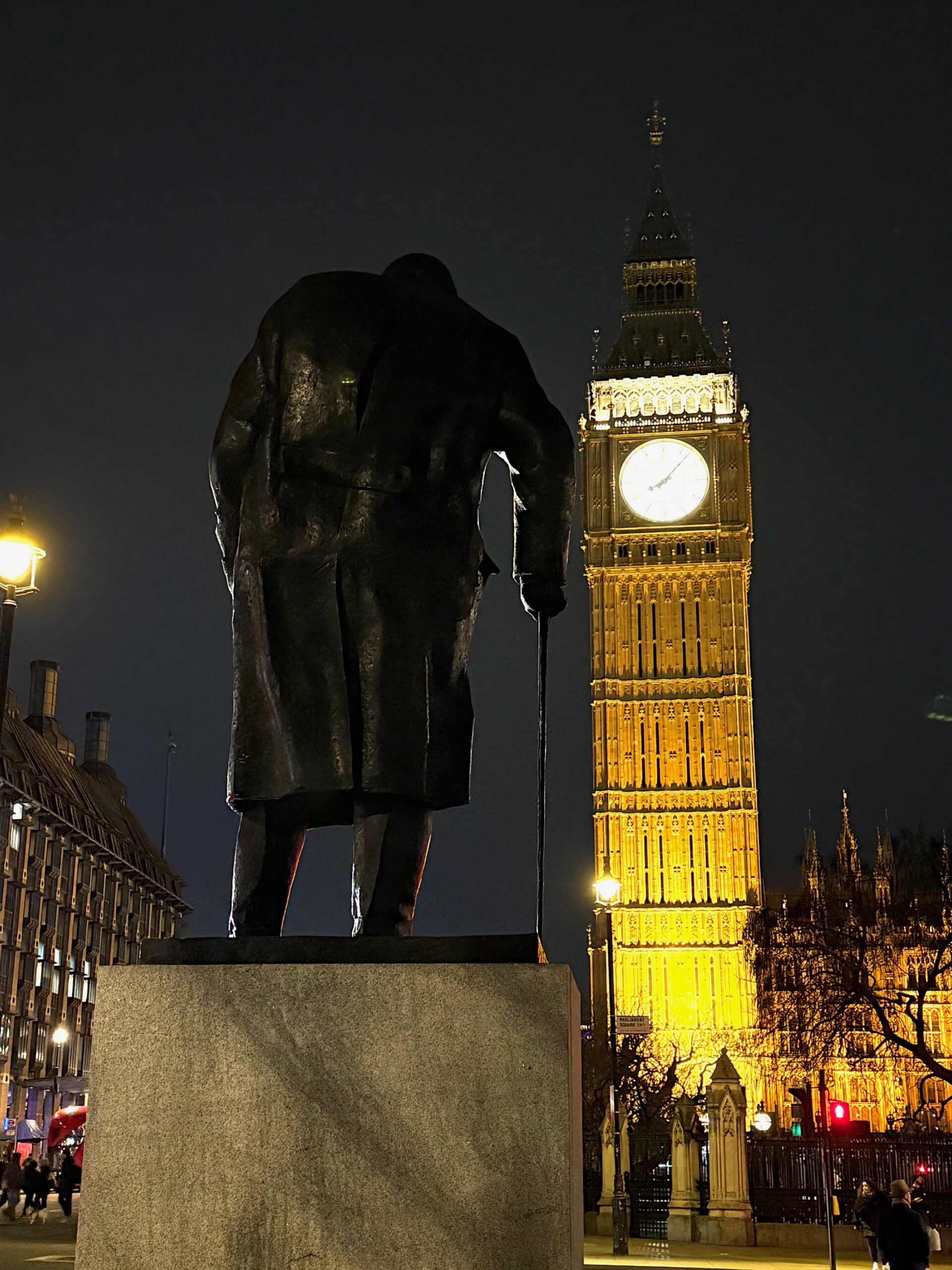 the statue of chruchill keeps watch over the big ben